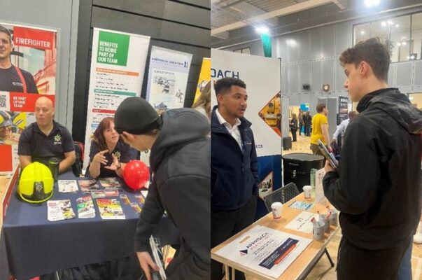 two young men with brown hair, wearing black speaking with men and women who are operating different stalls at Ashfield careers fair